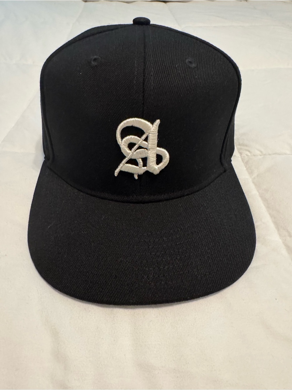 Men's Black Snapback Hat with White Script Emblem